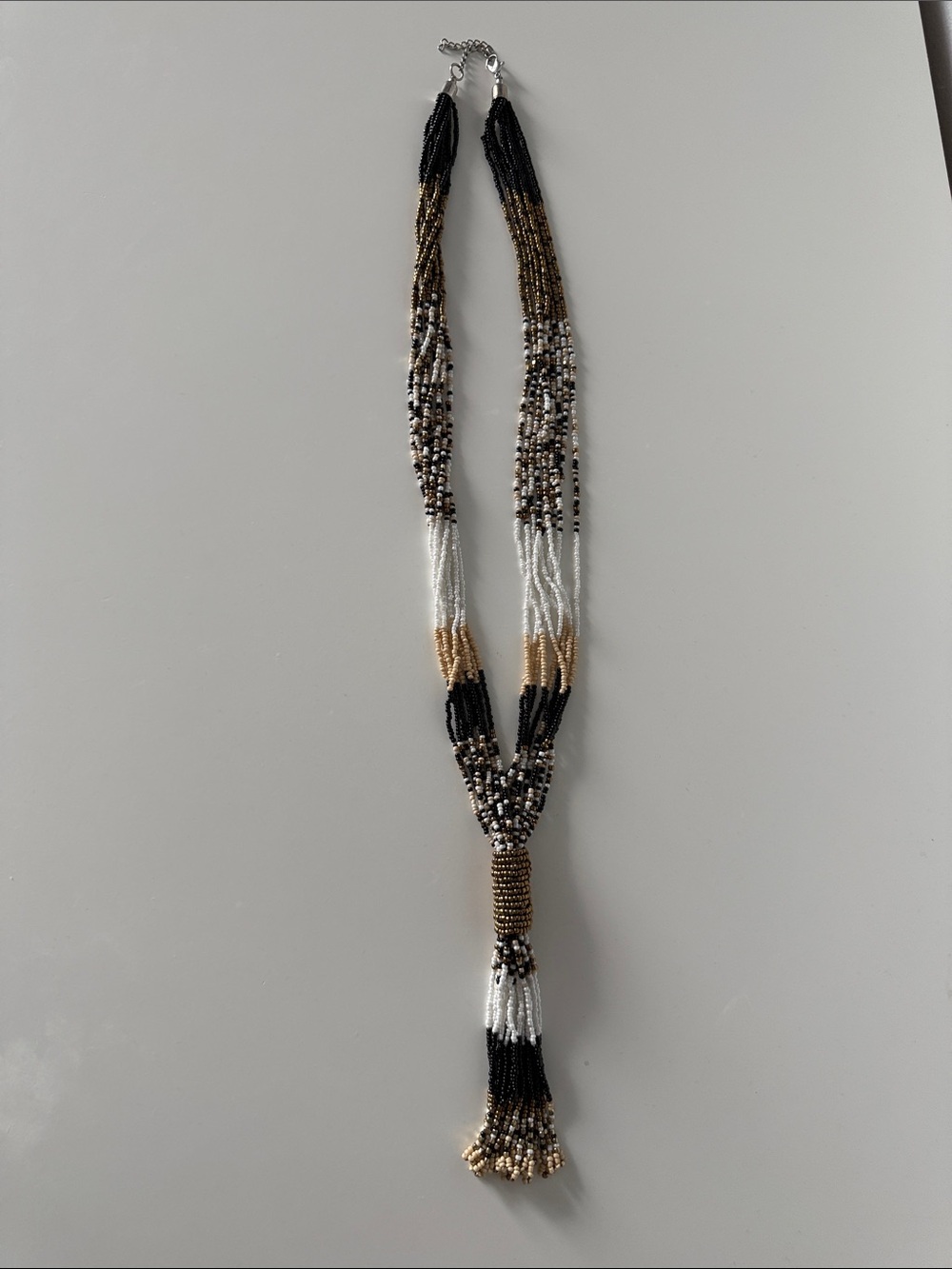 Multi-Strand Beaded Tassel Necklace in Black, White & Gold